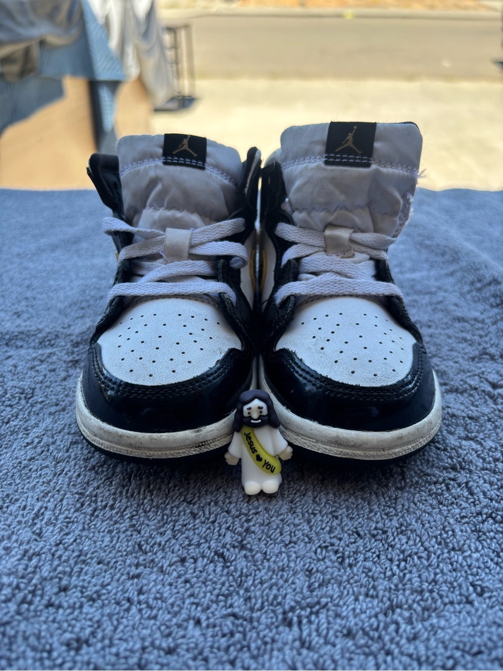 Jordan Kids Black and White High-Top Sneakers with Perforated Toe